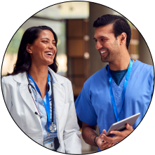 Nurse having conversation with doctor smiling