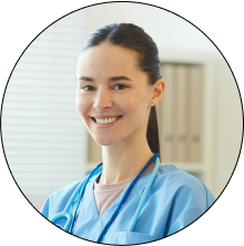 Nurse smiling while helping a patient